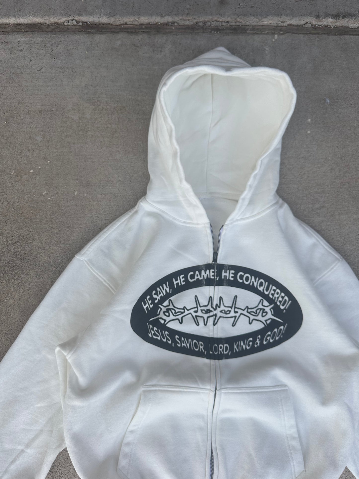 "HE CONQUERED" zip up