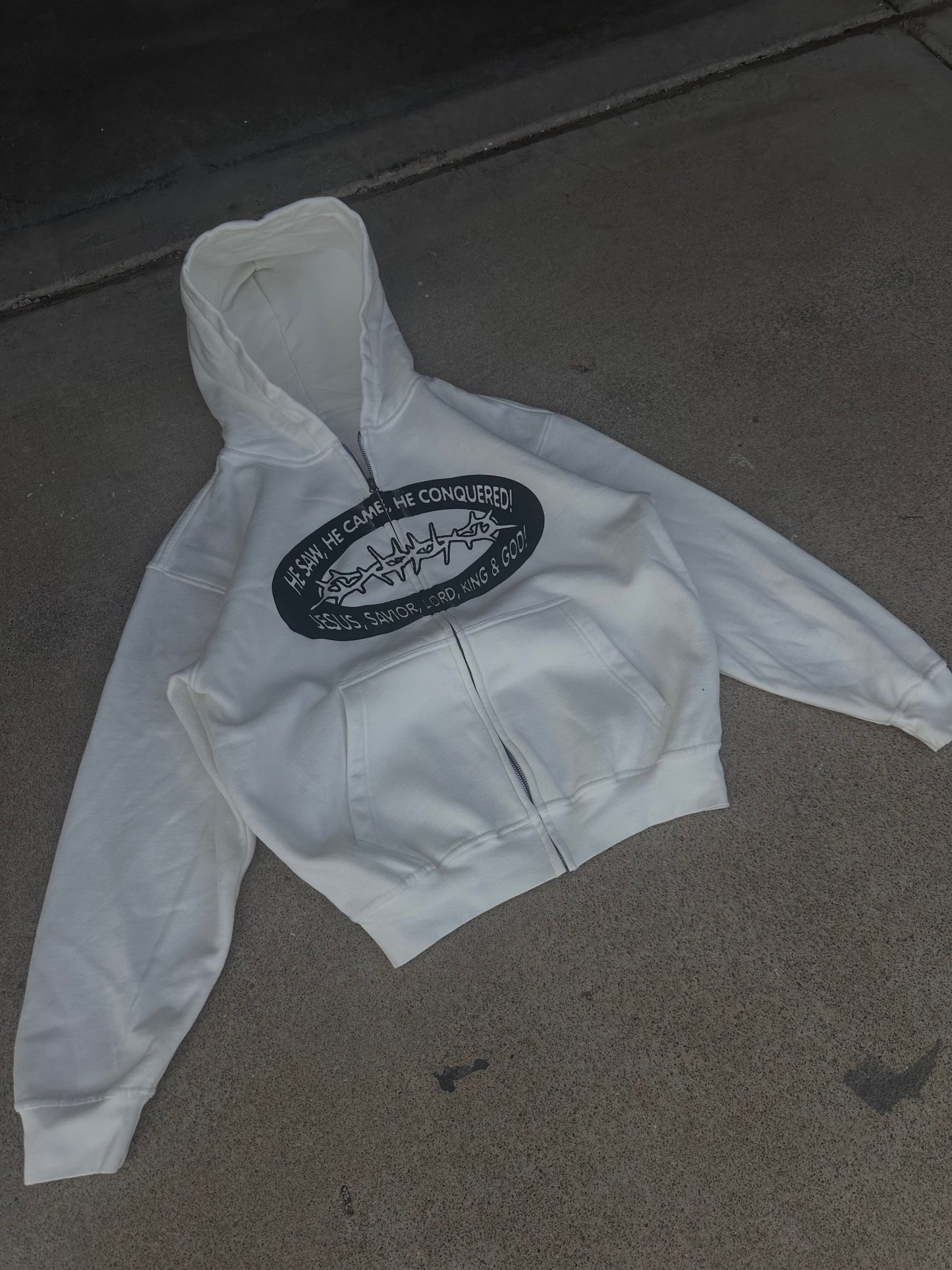 "HE CONQUERED" zip up
